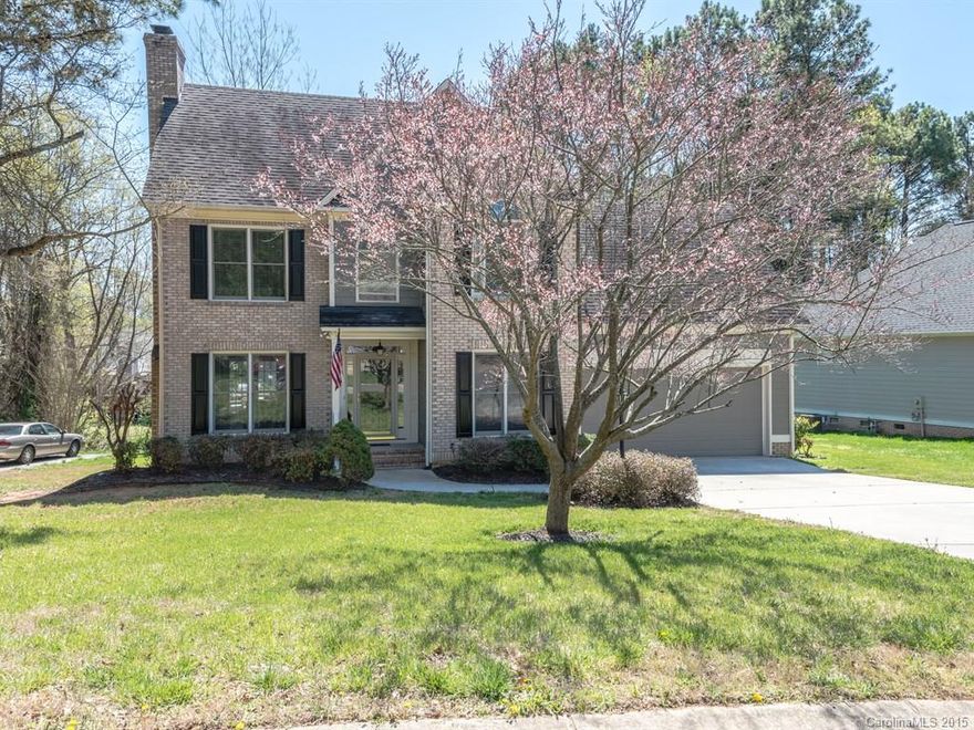 Move in ready home! Warm & neutral on great lot w/wooded backyard. New paint & carpet. Wood floors throughout entire main floor. Elegant crown molding entire main floor plus wainscot in DR. Crisp white kitchen w/blk & SS appls. plus tile backsplash & recessed lighting. Mstr BR w/tray ceiling & fan plus sitting area. MBth w/lovely framed mirror & jacuzzi tub. Lrg vaulted bonus rm over gar. Covered porch & deck plus firepit area perfect for entertaining overlooking flat backyard.