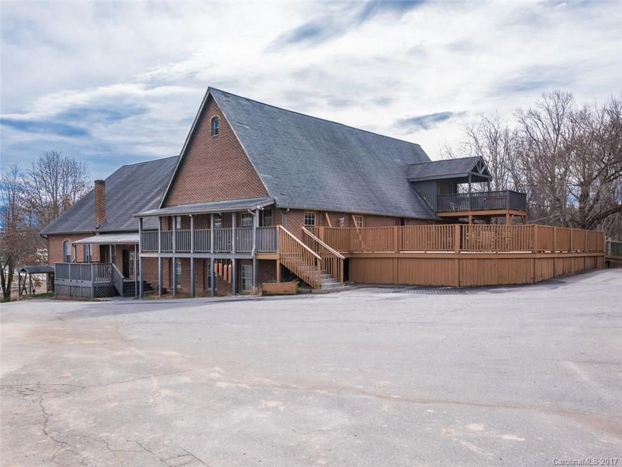 Over 11,500 sqft of prime commercial/ind space located directly across from New Belgium in the heart of the River Arts District. Large event space in this refurbished church with stage, offices, restrooms including ADA, & view of the RAD and mountains. Take advantage of dozens of separate rooms primed for offices or perfect for leasing space to local artists. With industrial style gourmet kitchen, expansive deck, huge garage/workshop, and CI zoning, the possibilities are limitless.