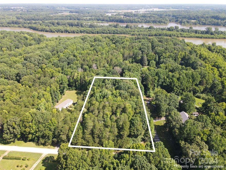 Two acre wooded parcel in the Lake Highrock neighborhood, just moments from the water.  This corner lot property has approximately 235' of road frontage on Buccaneer Circle and approximately 460' on Waccamaw Drive.  Manufactured homes allowed. Just minutes to I-85 access but in a rural setting! Gated boat landing for non-motorized craft with purchase of key and HOA membership.