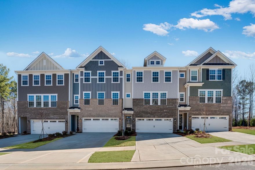 This new three-story end unit townhome showcases a gracious design. The lower level features a bedroom and full bathroom  plus a desirable two-car garage. Upstairs is an open floorplan among the spacious family room, a well-equipped kitchen and breakfast room with access to a large deck. All three bedrooms, including the private owner’s suite with a full-sized bathroom, are ideally situated on the top floor to provide restful retreats. Plus, our signature Everything's Included program means you will get quartz kitchen countertops, stainless steel appliances, luxury vinyl plank flooring, and so much more at no extra cost! Close to downtown Waxhaw, local shops, restaurants, retail and grocery stores. Just a short drive away are Uptown Charlotte and the Promenade at Carolina Reserve shopping center.
