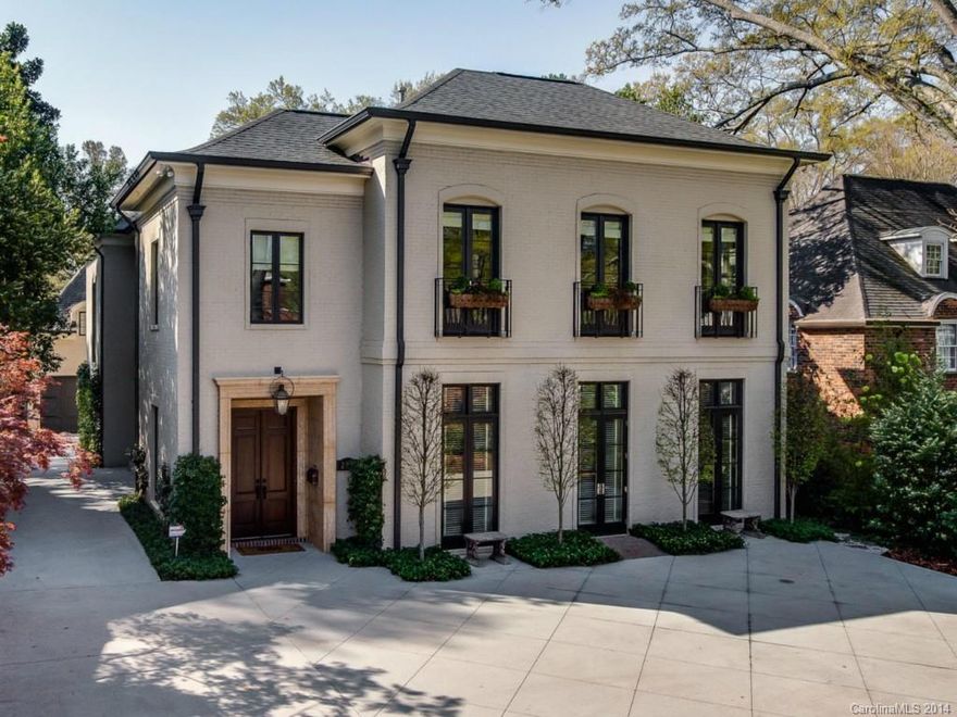 Stunning French Provincial home designed by Frank Smith . Large open spaces, warm & inviting with a great flow for entertaining or relaxing. 10ft ceilings down. Custom features throughout. Master suit has his & hers en suite bath with custom finishes. Gourmet kitchen with scullery open to great room & outdoor fireplace. Carriage house has open veranda below. All of this plus convenience in the heart of Myers Park.