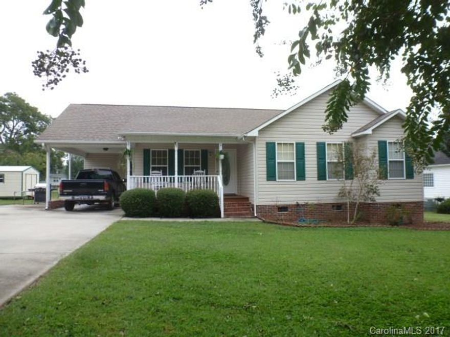 Great 3BR, 2BA home on .52 acre lot. Home has country front porch, large deck on back with a wonderful view of pastured horses, Single attached carport, nicely landscaped. Home features great room with vaulted ceiling, fml dining room, kitchen with range, microwave, dishwasher, and refrigerator, to remain. MBR with walk-in closet. Utility room attached to carport. Outside storage building.