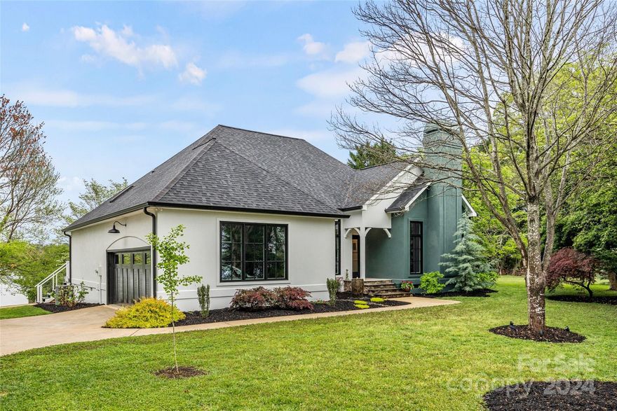 Incredible waterfront property with breathtaking panoramic views! Prepare to be impressed with the abundant attention to detail as this home has been exceptionally maintained & is beautifully updated. Hardwood floors throughout, fresh paint, upgraded fixtures + so much more! All windows & most doors have been replaced. All bedrooms have water views + access to the expansive rear deck. Primary suite features primary bathroom with soaking tub, custom tile shower & walk in closet. Kitchen boasts painted cabinets, granite counters & stainless appliances, including a gas range. Refrigerator + washer/dryer to convey. Garage with space for cars + storage. Situated on a rare .84 acre lot with over 250’ of shoreline + deep water at dock + the most magnificent views! Enjoy the beauty of it all while relaxing on the large deck that extends across the entire rear of the home. Covered dock with boat lift & shoreline rip rap are only a few years new. This is truly one of Lake Wylie’s hidden gems!