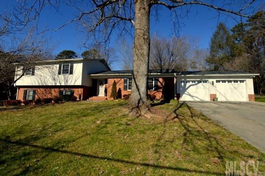 This impeccably maintained home home is located in desirable Lower Creek. Pride of ownership shows throughout this beautiful home. The spacious living room has lots of windows allowing for plenty of natural light and a great view of Hibriten Mountain. You will find gorgeous hardwood flooring in the living room and formal dining room. The kitchen boasts of corian countertops, timeless white cabinetry, pantry with slide out shelving, and ceramic tile flooring. The downstairs den is very  cozy with newer carpeting and a gas log fireplace. The master suite is very serene and spacious. One of the greatest assets of this home are the deep oversized closets not found in most homes. There's additional storage in the basement and outbuilding. This home is extremely neat and clean and will be a pleasure to show!