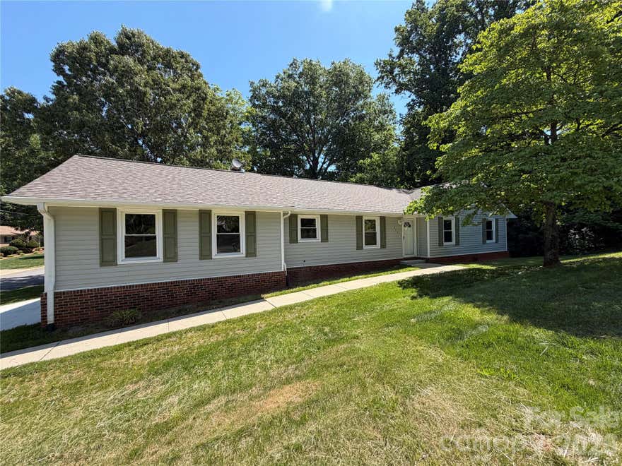 Very well maintained three bedroom, two bathroom home with a partially finished basement! Located on a corner lot. Large living room with vaulted ceilings and fireplace. Open floor plan to kitchen and dining room. Primary bedroom suite located at the back of the house with two walk in closets. Laundry room located near back deck and off the living room area. Secondary bedrooms and secondary bathrooms along main hallway upstairs.  Basement area features four finished rooms and a utility area. Large back deck with new concrete patio below. Two car garage with all new garage door and opener. Property does feature an addional lot that adds natural screening to this corner lot.