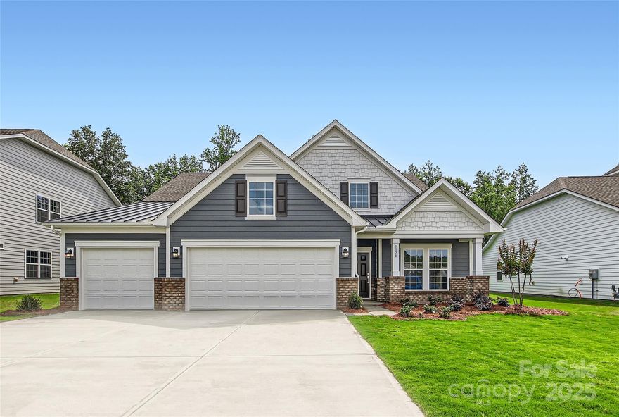 This new single-story Harper floorplan combines elegance and comfort. An open-plan layout connects the modern kitchen, dining room and spacious family room, which features a door providing direct access to the covered patio. A formal living room off the foyer is ideal for hosting guests. The sprawling owner’s suite with a private bathroom and a secondary bedroom are situated on opposite sides of the home for enhanced privacy. A desirable three-car garage provides ample storage space. A third bedroom is an option. Plus, our signature Everything's Included program means you will get a gourmet kitchen with double ovens and cooktop, quartz or granite kitchen countertops, subway tile backsplash, ceramic tile, luxury vinyl plank flooring, and a gas fireplace (per plan) at no extra cost! Harris Mill located in a sought-after Indian Land, offers luxury homes and quarter acre and wooded homesites.