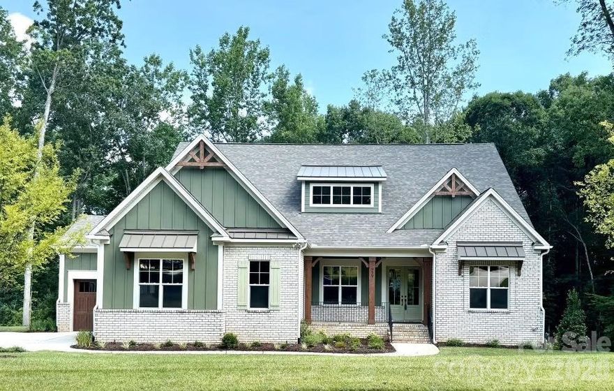 Beautiful new custom home in the Irish Creek Country Club community. Enjoy the convenience of a luxurious main-level primary suite and a guest bedroom, on the mail level.
The open-concept kitchen flows effortlessly into a spacious family room, creating the perfect setting for entertaining large gatherings. A versatile flex room offers flexibility as a home office or elegant formal dining area.
Upstairs, two additional bedrooms share a full bath, while the expansive fourth bedroom is large enough to also be used as a recreation/bonus room. 
This New Construction Home features a basement which  boast a fifth bedroom with ensuite bath, a full kitchen, and a dedicated entertainment area.  Plus, home has a 3-car garage.

Homesite is built on combined lots 29 and 30 and requires additional HOA fees as noted. Seller is including up to $5,000 toward closing costs in conjunction with preferred lender. All contracts to be written on Seller/Builders contract forms. Consult with Builder Representative for additional details.