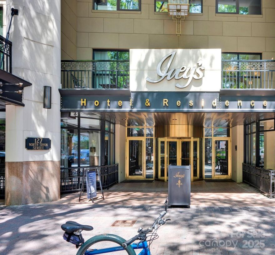 Live in the iconic Ivey’s building in Uptown Charlotte! This updated 2 bed, 2 bath condo offers 1,431 sq ft of light-filled space with tall ceilings, hardwood floors, and floor-to-ceiling windows with remote-controlled blinds. Recently refreshed with new paint, water heater, custom built-in shelving with integrated lighting, and redesigned primary closet. Includes a garage parking space and a private, covered storage unit on top floor. Mounted TVs and select furnishings available with acceptable terms. Amenities: 24-hour concierge, fitness center, residents’ lobby, and 20% off at Sophia’s Lounge. Close to Charlotte’s top dining, nightlife, sports, and entertainment venues!