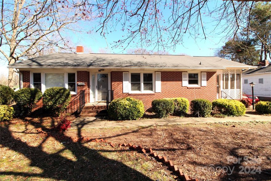 Nice, 3 Bedroom, 2 Bathroom,  Brick, Ranch Style home located on .785+/- Acre lot in the City Limits of Clover. This home has hardwood Flooring in the Living Room and all the Bedrooms. This home was built in 1965 and has approximately 1298 heated square feet.  Screened Porch.  This home is situated on a larger city lot with two detached storage buildings, one is approximately 189 square feet  and one is approximately 1454 square feet. The larger building was built 1920+/- and does have a roof leak that the owner does not intend to repair. Gas Heat, Central Air and Electric Water Heater. This property is located just minutes from grocery stores and eating establishments.