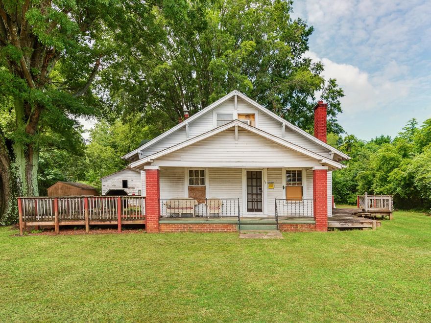 Great Investment Opportunity! 3 Bedroom, 2 Bath, additional living quarters upstairs, 2 storage buildings, covered porches on front and back. Great lot. Spacious rooms. Priced to sell. Won't last long. Book your showing now!