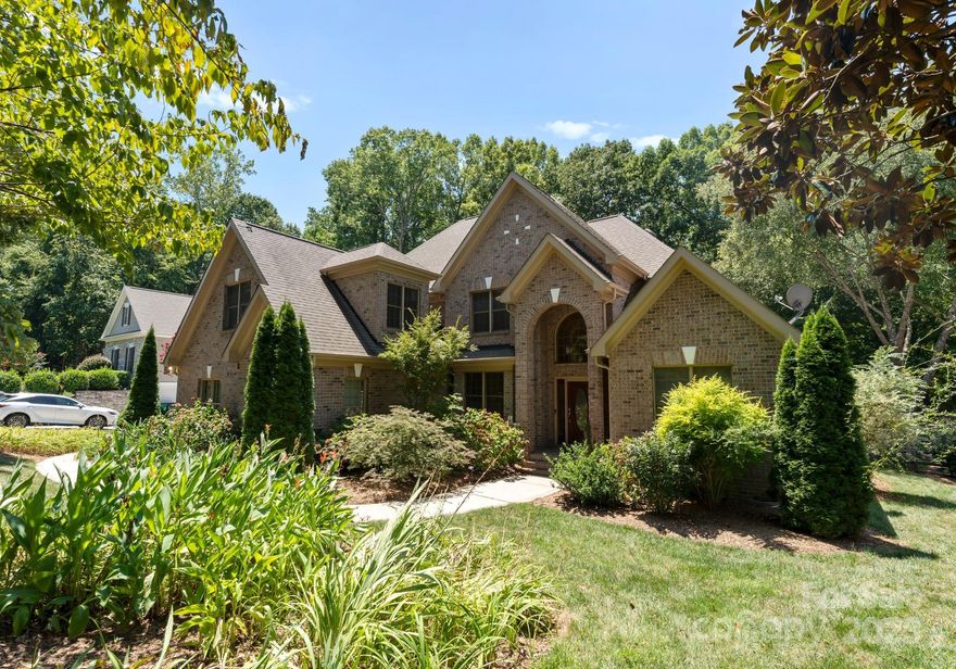 Stunning waterfront 4BR/3.5BA home on a .73-acre lot with 3 car garage and deep water access! Enjoy hardwoods throughout most of the home, updated kitchen with Wolf range and updated baths, a main-level primary suite. Upstairs enjoy 3 bedrooms, 2 full baths, bonus room and a loft. The backyard is an entertainer’s dream—turfed and professionally landscaped along with a putting green and featuring a large trex decking porch with with both uncovered and covered areas with electronic screens, fireplace, TV, outdoor kitchen, and a storage building. Relax at one of the nicest 2-story docks you will see with a screened-in boat house on the deep water canal. Community amenities include clubhouse, pool, tennis, playgrounds, boat storage, launch, basketball court, soccer field, and walking trails.