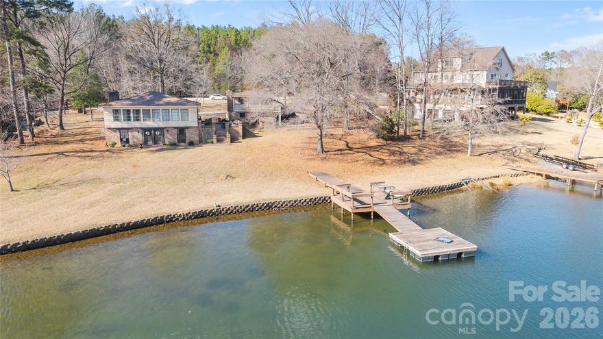 Rare opportunity to own a Lake Wylie waterfront home in South Carolina with flat, usable lake frontage, no HOA, and two private docks—a highly sought-after combination that is difficult to find.

Located on a wide, scenic stretch of Lake Wylie, this property offers long-range water views, excellent privacy, and direct access to one of the most desirable lakefront areas near the Charlotte region. Ideal for buyers searching Lake Wylie homes for sale with dock, waterfront property near Charlotte NC, or a buildable lakefront lot.

The main home features 2 bedrooms, 1 full bathroom, with a flexible layout including potential for two kitchens, making it perfect for renovation, Airbnb/short-term rental, or multi-generational living. The home is currently mid-renovation, giving buyers the ability to customize and add value.

A major highlight is the separate guest house (1 bed, 1 bath)—ideal for a guest suite, rental income property, pool house, or home office. This added structure creates strong appeal for buyers looking for income-producing waterfront property or additional living space.

The flat waterfront lot with easy walk-to-water access is perfect for outdoor living, entertaining, or building a custom luxury lake home. Whether you’re searching for a fixer-upper on Lake Wylie, a tear-down to build new construction, or a move-in ready lake investment property, this listing checks every box.

Don’t miss this chance to own a prime Lake Wylie waterfront property with endless potential.