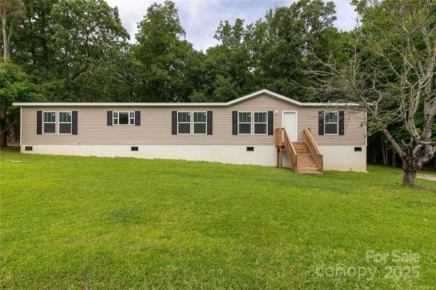 So much space in this large home with an open floorplan. Large kitchen with island perfect for the cook. Huge laundry room. Call us today to make this home yours