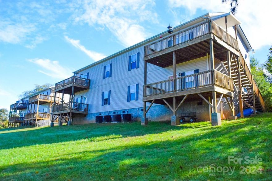 Fully leased eight-plex located off New Leicester Hwy. Property is on well and septic with no interior common areas to maintain. Located in a quiet, peaceful and scenic area and close to town. All units have decks and a view. Property management company in place and knows all tenants and the property. See the attached list of expenses. Some of the expenses should be less going forward.  Some rents are lower at $1275 and $1400. Others are at market value bringing $1600. The rent amounts could easily all be brought up to market and bring in an additional $1562 a month for the complex.