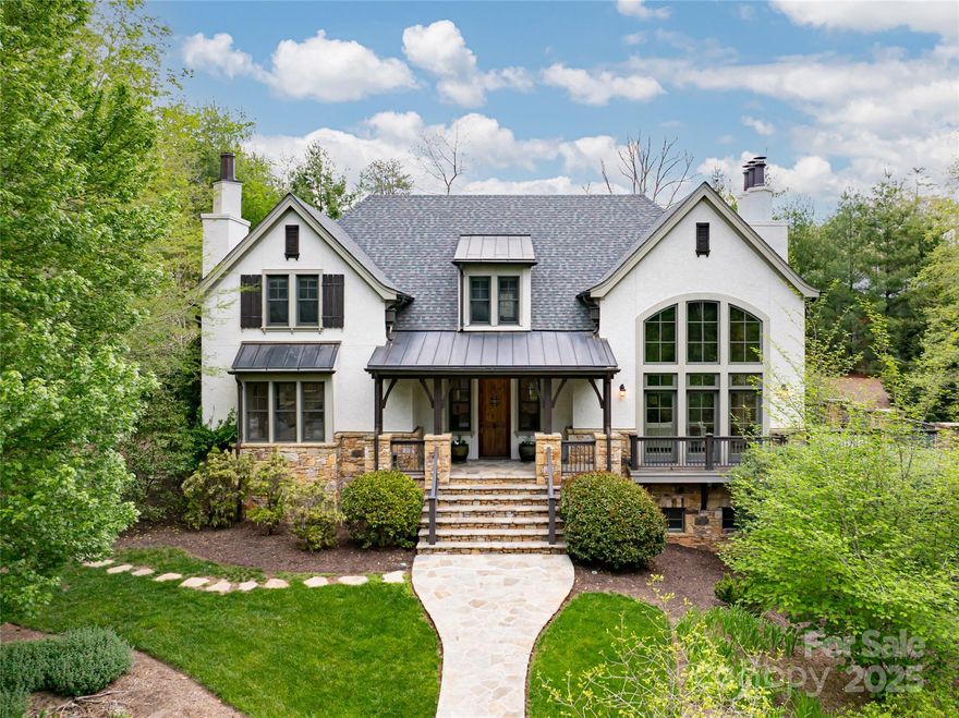 Experience the rare offering of 32 Ramble Way — a custom-built estate on a private double lot in Asheville’s premier gated community, The Ramble. Five bedrooms, all en suite, and thoughtfully designed open living spaces combine with luxurious finishes, including a chef’s kitchen with Thermador and Bosch appliances, premium counter tops, and dual fireplaces. The private backyard is a true retreat with a heated pool, swim-up bar, waterfalls, hot tub, outdoor kitchen, and fireplace. Fossils embedded in the floors, a movie theater, library, fitness room, second full kitchen, whole-house filtration, and smart-home tech add to the home’s exceptional livability. Ideally located near Longmeadow Park and Ramble amenities, this home offers seclusion without sacrificing access to trails, tennis, pickleball, the Living Well Center, and community spaces. Own a home where lifestyle, luxury, and legacy meet.