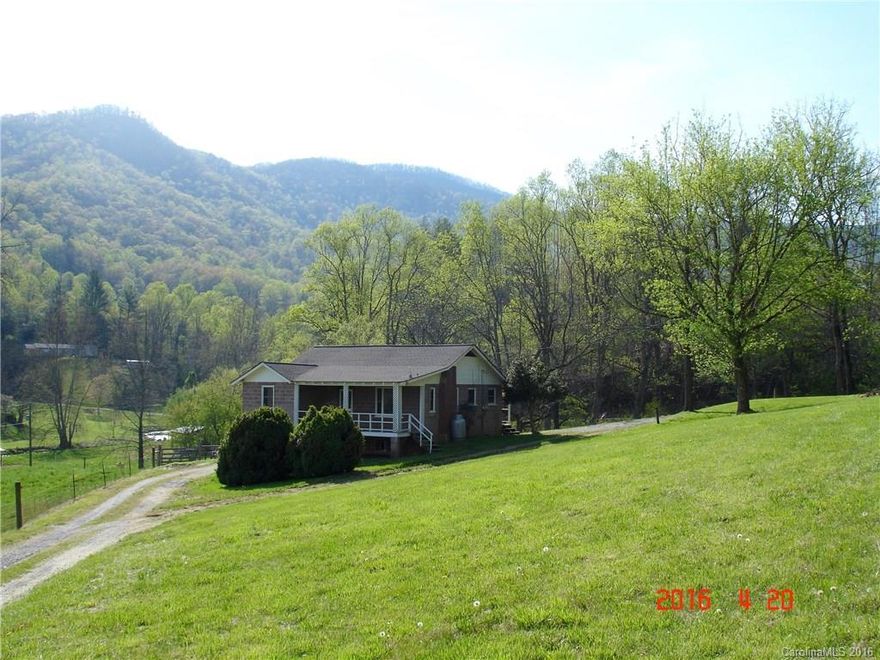 Cullowhee-Just 2 miles off  the WCU campus and move in ready - This home/duplex has 3 bedrooms/1 bath on the main level and 3 bedrooms/1bath on the basement level. (No septic on file due to age.)  Great rental property as you could rent both levels or just live in one level and rent the other.  Enjoy the pastoral setting, the valley views, and unrestricted property.  Lower level has been completely updated with a patio entrance while the upstairs has the country porch.