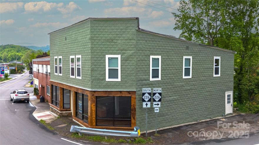 The historic Greene building is back on the market! This year marks the 103rd year this building has stood! Current updates within the last three years; all new windows, new store front windows and front door. New bathroom on main level, secured the foundation of the entire building by Stan Cook Engineering, Remodeled upstairs bath, insulated new walls on main level, new kitchen upstairs, painted and sealed the exterior, 2 Mini split systems keeps the upper level comfortable during all seasons and the main level is serviced by a oil furnace located in the basement. The Bakersville community show cases artists from across the country and is home the Penland School of Crafts which is about 8 miles away. The building is easily accessible for walking tourist. Offering two floors above ground with gorgeous store front windows. This is truly a blank canvas; currently used as a appartment but with no zoning in Bakersville the choice is yours! Schedule your showing today!