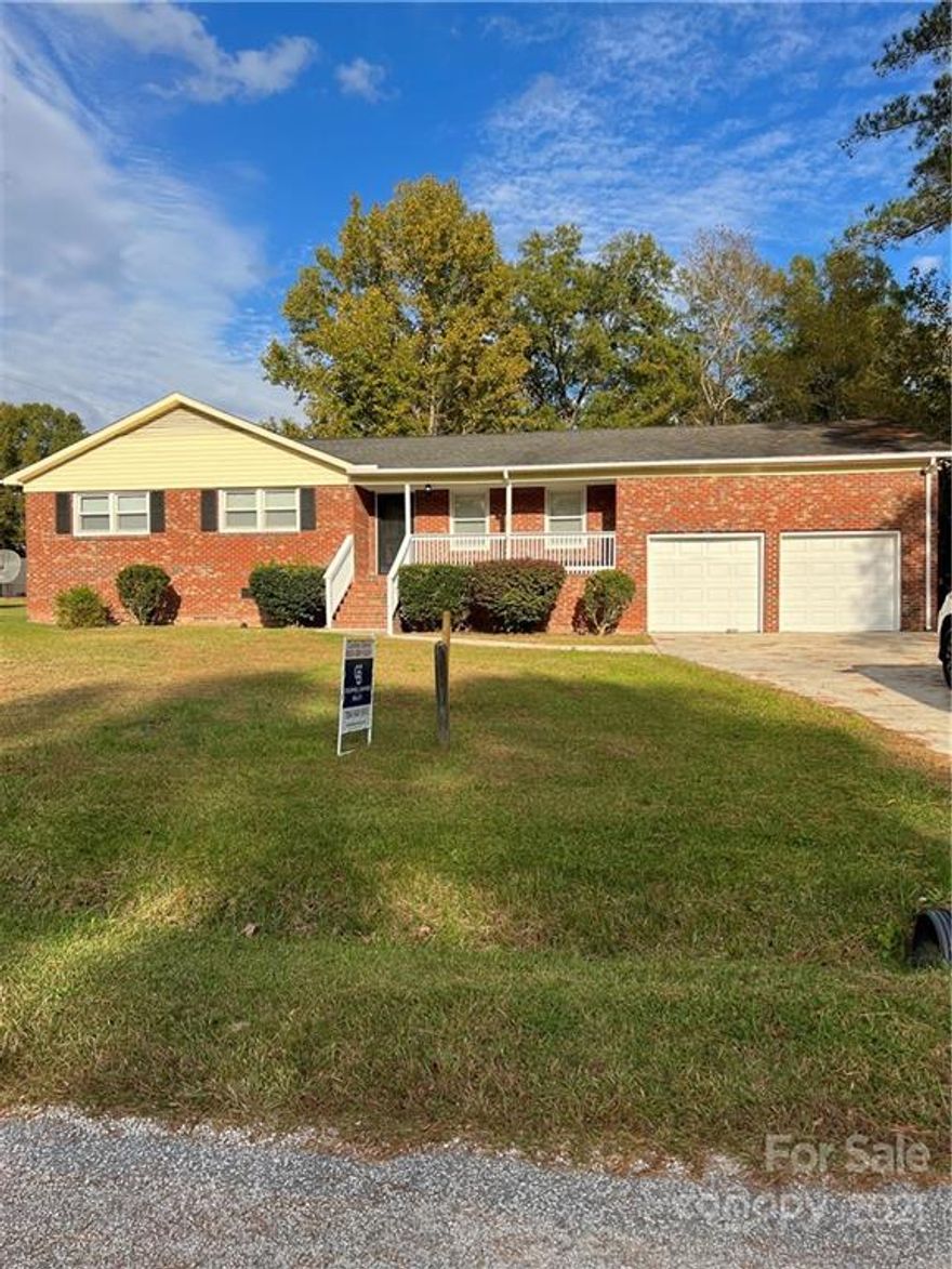 Newly renovated all brick home with three bedrooms and 2 full baths. This is a rare find on a gorgeous half acre plus lot. This home features a beautiful front porch perfect for rocking chairs. The backyard is massive and allows for many options.