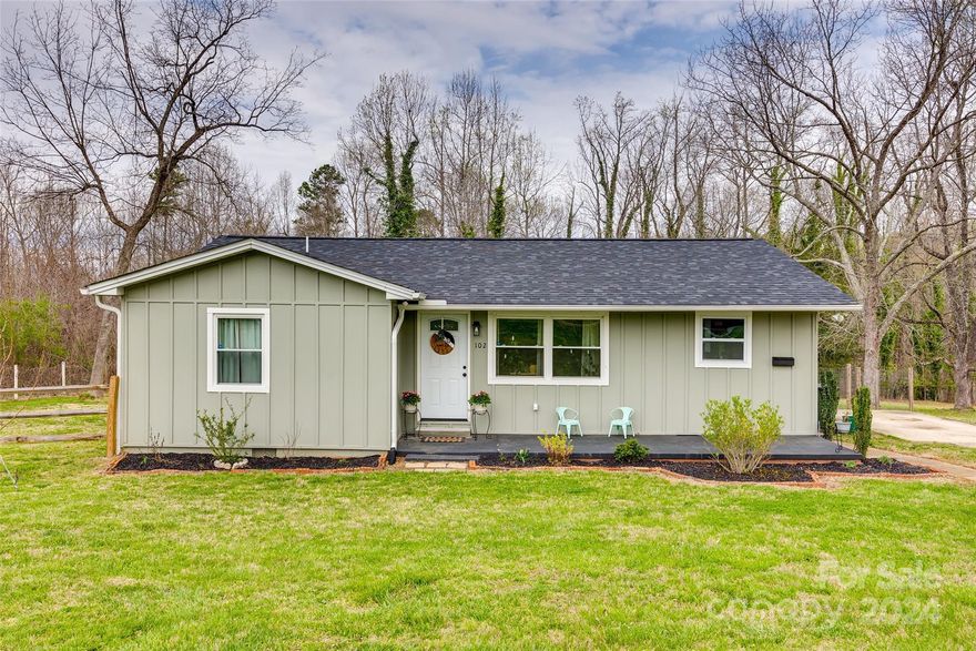 Welcome home to this charming ranch-style home in downtown Clover, SC! This beutifully updated and well maintained home boasts an array of modern updates, including updated vinyl plank flooring and stainless steel appliances, ensuring both style and functionality. Inside, the home features contemporary lighting fixtures and a convenient mudroom for added organization. Situated on just over an acre lot, picture yourself enjoying the outdoors, gardening or simply enjoying room to stretch right in the heart of downtown. Spend some time on your covered front porch, perfect for relaxing evenings under the stars or morning coffees. Schedule your tour today, and experience first hand the epitome of comfort and convenience in this lovely home.