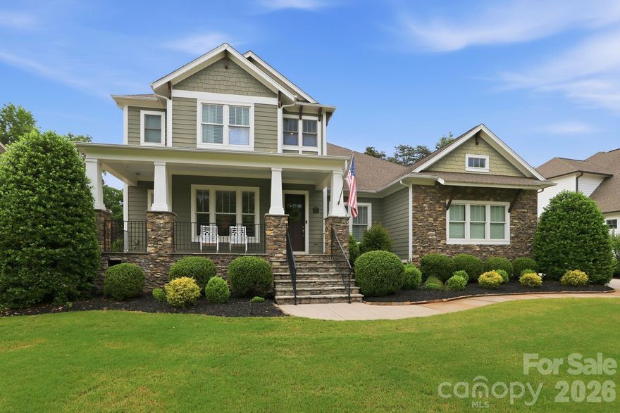 Impressive 5 Bedroom Home on Springfield Golf Course in a Premier Fort Mill Neighborhood. Just minutes from downtown Fort Mill and an easy commute to Uptown Charlotte and Charlotte Douglass Airport. This beautifully maintained 5 bedroom, 4.5 bathroom home is move-in ready and designed for both everyday living and exceptional entertaining. The welcoming front porch greets you into a gracious foyer, flanked by a formal dining room and in home office that both overlook the front yard. The heart of the home features an open concept kitchen and living area, thoughtfully designed for gathering. Step outside the main living area to your oversized covered back porch with fireplace, private flat usable yard, and stamped concrete patio where the hot tub awaits. Back inside the Primary suite is tucked away on the main level for ultimate privacy. The Primary Bath has been fully remodeled and is a spa-like oasis. An additional bedroom on the primary level with an ensuite bath awaits your guests. Head upstairs on the beautiful curved staircase, where you will find three bedrooms, two full bathrooms and a bonus room perfect to function as a media room, guest retreat or playroom. This is truly an entertainer's and family dream, offering exceptional space, comfort, and prime location. A gem not to be missed. The neighborhood offers an assortment of amenities including clubhouse, pools, playgrounds, tennis courts (finishing up complete replacement of six tennis courts and pickleball courts), walking trails, and a public golf course that is a separate pay-to-play course. HOA dues also include an annual family membership to Anne Springs Greenway, which is located across from the neighborhood. Price includes buyer credit for exterior painting (choose the same color or buyer has ability to change exterior color based on ARC approval).