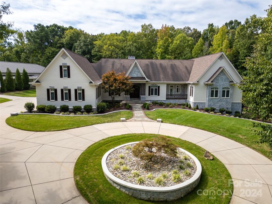 Custom Built 4Br/7.5Ba Brick Home nestled on a Sprawling 10-acres inside a Private Gated Community. Gorgeous Chef's Kitchen recently updated w/high end appliances,  Indulge in your Luxurious Primary Bedroom & updated spa-like Primary Bathroom. Three additional Bedrooms each w/ Private En-Suites Finished Basement is a versatile space featuring a Full Kitchen, Exercise Room, Full Bathroom w/a Steam Sauna Shower, and a Movie Room for the ultimate entertainment experience. 3-Car Attached Garage that allows plenty of space for your vehicles and storage needs. Step outside to your Private Paradise w/Saltwater Pool, Hot Tub, Sand Volleyball area, and a Custom Recreational Soccer Field with stadium lighting. Perfect for hosting gatherings. 5000 sqft Detached Garage is an impressive space featuring 4 car lifts, ideal for car enthusiasts or extra storage. See Included Feature Sheet for all the recent updates/enhancements.Small corner of land in flood zone, seller not required to carry insurance