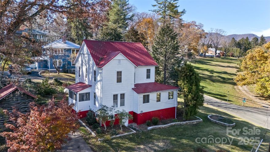 Charming 1919 Victorian Farmhouse with Modern Updates
Step into this beautifully maintained 1919 Victorian farmhouse, where timeless character meets modern convenience. Recently refreshed with a fully painted interior and exterior and refinished original hardwood floors, this home radiates warmth and pride of ownership throughout.
Enter through a cozy enclosed mudroom at the back of the home and discover a spacious kitchen featuring custom concrete countertops, stove, refrigerator, and dishwasher, plus plenty of cabinet space. Just off the kitchen are a bright breakfast area and a formal dining room—perfect for family meals or entertaining.
The expansive living room offers high ceilings on the main floor, a gas fireplace with ventless gas logs, and built-in shelving. From here, step into a sunroom surrounded by windows, ideal for relaxing year-round. French doors from the sunroom open onto the large covered front porch, a wonderful spot for morning coffee or evening gatherings.
Throughout the main level, high ceilings, charming built-ins, and beautifully refinished oak and pine floors showcase the craftsmanship of a bygone era.
Upstairs, you’ll find four spacious bedrooms and a full bath, providing plenty of room for family or guests. The elegant wood staircase adds to the home’s vintage charm. A half bath on the main level includes a closet that could easily be converted into a full bath with a shower for added flexibility.
This home is serviced by city water and sewer and features a propane furnace for comfort and efficiency. The unfinished basement offers approximately 420 square feet of additional space—ideal for storage, a workshop, or future expansion.
Outside, the property is just as enchanting. The beautifully landscaped yard features river stone accents, manicured gardens, and mature shade trees that help keep the home cool in summer. A classic brick walkway leads from the front porch to the street, while a stone walkway winds through the backyard to a private stone patio with a built-in BBQ grill—perfect for outdoor entertaining or quiet evenings under the stars.
A fenced area provides a safe haven for pets, and rear parking offers easy everyday access. A large workshop adds abundant storage and workspace for hobbies or projects.
Seller is offering a $10,000 credit to buyer.
With thoughtful updates, timeless architecture, and a picture-perfect setting, this Victorian farmhouse beautifully combines historic elegance with modern comfort—ready to welcome you home.