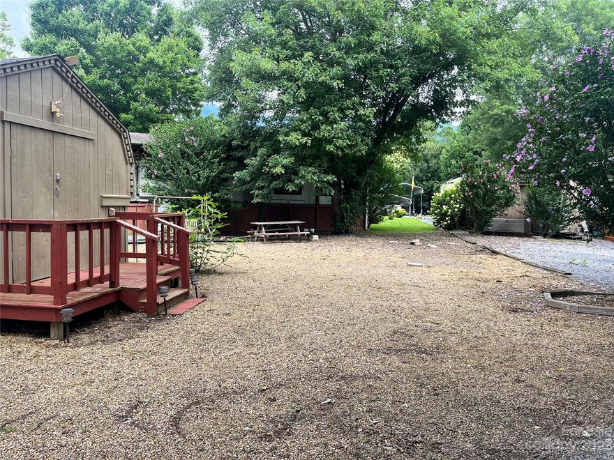 The wonderful and desired Dogwood Lakes offers this level graveled lot with a large 10x11 storage shed ready for you with a secure keypad for entry.  This RV lot has a 5th wheel hook and water with meter in place, 50 amp power, gardens and a flowering tree, also ample parking.  Just a short walk to all three Lakes and close to the River “beach” common area for access to year round fishing, swimming and relaxing.  These lakes are home to tons of Fish and Birds, with relaxing nights, fishing and feeling the breeze.  At a great price, don’t miss your opportunity to own your mountain RV lot for those long vacations or full time living.  You can also put your very own park model here, to join in the community of RV’s and Park models and smiling neighbors.  No short term rentals allowed