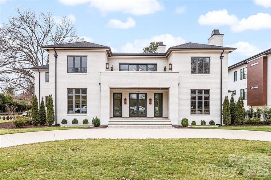 Located in the heart of Myers Park across from Freedom Park, this exceptional full-brick residence offers over 7,000 square feet of refined living space on a beautifully positioned 0.46-acre corner lot. Built in 2024, the home blends timeless architecture with thoughtfully designed modern comfort. The main level features expansive living and entertaining spaces, including a gracious dining room, elegant living areas, and a chef’s kitchen outfitted with premium appliances including a gas cooktop, beverage refrigerator, ice maker, tankless water heater, and more. A main-level primary suite provides convenience and privacy, complemented by a luxurious en-suite bath. An additional main-level bedroom offers flexibility for guests or office space. Upstairs, you’ll find four spacious bedrooms, multiple full baths, a bonus room, flexible living space, and additional laundry access, creating ideal separation and functionality for everyday living. Outdoor living is equally impressive with a heated in-ground pool and spa, in-ground hot tub, irrigation system, and a private fenced backyard designed for relaxation and entertaining. The circular driveway and side-facing three-car attached garage provide both convenience and striking curb appeal. Situated within close proximity to Dilworth, Sedgefield, and all that Myers Park has to offer, this home delivers luxury, location, and lifestyle in one of Charlotte’s most sought-after neighborhoods.