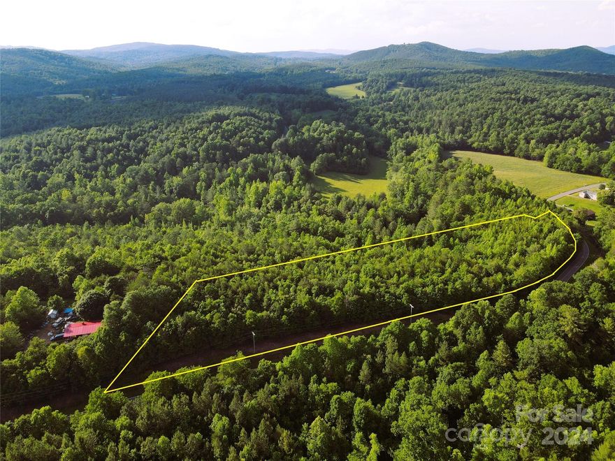 6.94+/- wooded acres with over 1,400' of road frontage. This tract is in shadows of the South Mountains and is zoned R-MU (Rural Mixed Use) which allows for numerous options. Convenient to South Mountains State Park and South Mountain Game Lands. County water is at the road, septic would be required. This tract does have a small cemetery  located on it (see pics for location)