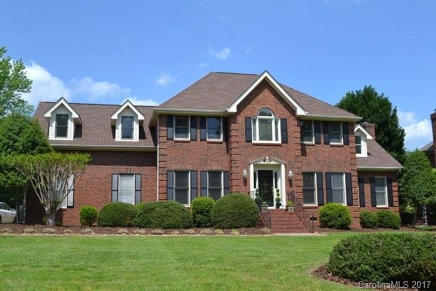 All brick home with tons of living space and storage!  Formal dining room and living room/office, huge great room with fireplace. Lots of family gatherings will be hosted in the very large kitchen with huge work island and eating area and you will enjoy morning coffee in the sun room.  Master suite has a sitting area.  4th bedroom could be used as a bonus room.  There is a covered back porch that could easily be changed out to a screen porch and a patio area.  Seasonal view to the lake.