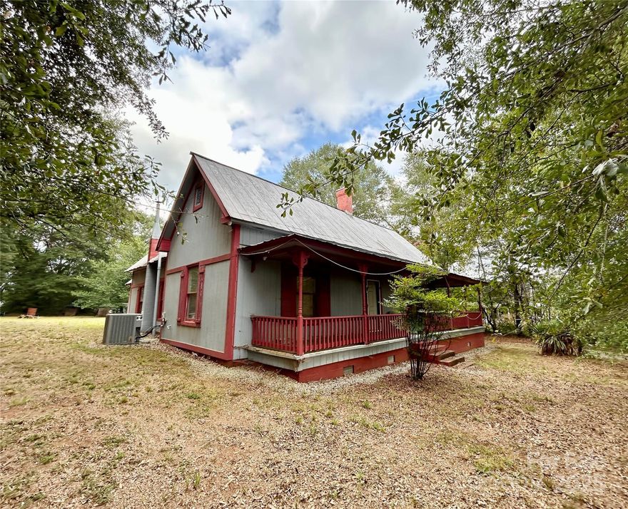 MOVE IN READY! Welcome to this delightful 2 bedroom, 1 bath, 1,360 square foot home, nestled on a .54-acre lot in a country setting. Built in 1910, this historic gem combines classic charm with modern conveniences. Featuring a lovely front porch with historical details, perfect for enjoying your morning coffee, this home offers a true escape from the hustle and bustle. 

This home offers a unique opportunity to live in a piece of history with all the amenities you need for modern living.
Inside, you'll find spacious rooms with abundant natural light, showcasing the home's original character while offering the comfort of HVAC for year-round climate control. The property also boasts public water with Broad River Water Authority, providing added convenience. There is still an original well, however, it is not connected.

Outside there are three buildings, one of which has power, and two detached carports. 

2.8 miles from Highway 74.
1.1 miles from Thomas Jefferson Classical Academy.
1.3 miles from Hutchins Snack Bar.
7.5 miles from Main Street, Forest City, NC.

Come see it today and imagine the possibilities!