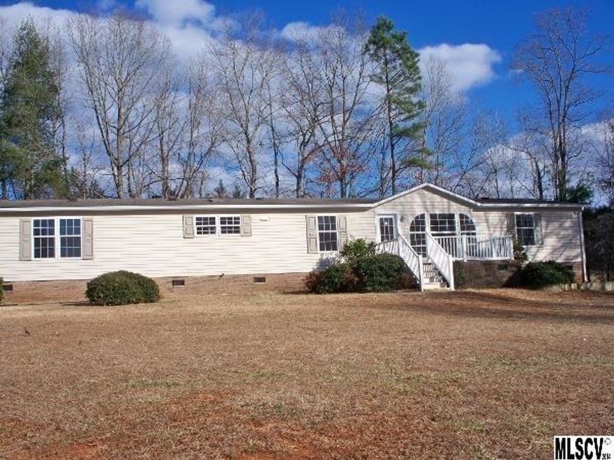 Wooded privacy at the end of the road.  This home is better than new.  Concrete front porch.  Extra large rear deck.  A very large great room serves as a formal living area and dining area.  The kitchen is open to a den with a fireplace.  The kitchen has new appliances and is brightened by a skylight overhead.  This home has a split bedroom plan.  The bathrooms boast built in cabinets.  Just off the master bedroom is a large dressing room with shelves and storage galore.  The master bedroom has a WIC as well.  There is also a half bath in the center of the home.  The other 2 bedrooms are good size rooms as well.  The home has new carpeting and paint and is move in ready.  Bring the family because there is room for all.  This is a Fannie Mae HomePath property.
