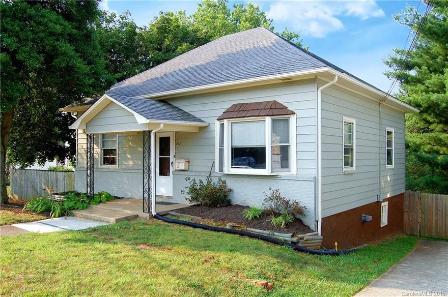 In the heart of West Asheville, directly on Haywood. HR-3 zoning allows residential, commercial & office. Great for live/work!  Also has redevelopment potential. Updated electric, HVAC & roof.  Tall ceilings, bay window, refinished pine floors, central heating-cooling and huge bathroom. Partially finished daylight basement w/ rear access. Nice front yard, covered porch, driveway for off-street parking, and huge fenced back yard for kids or pets.