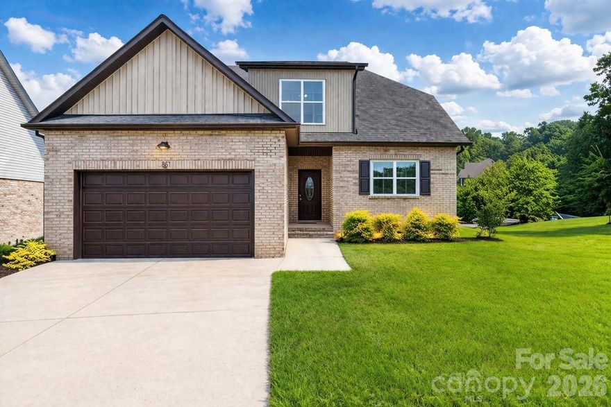 Minutes from the Hickory Riverwalk, downtown Hickory, parks, App State, and local coffee shops, this beautifully designed new construction in Waterstone offers the perfect blend of location, style, and functionality.

Featuring 4 bedrooms, 2.5 baths, and a versatile bonus room ideal for a home office, gym, or flex space, this open-concept layout is built for everyday living and entertaining. The kitchen stands out with quartz countertops, a large island, gray cabinetry, and a modern tile backsplash, flowing seamlessly into the main living area with an electric fireplace.

Upstairs, the spacious primary suite offers a walk-in closet, double vanities, and a sleek tile shower. Three additional bedrooms—each with walk-in closets—share a well-designed bathroom with dual sinks.

Additional highlights include luxury vinyl plank flooring throughout, convenient main-level laundry, ample storage, and a thoughtfully designed floor plan.

Located in a desirable community with a neighborhood pond and access to top-rated schools, this home delivers comfort, convenience, and long-term value.