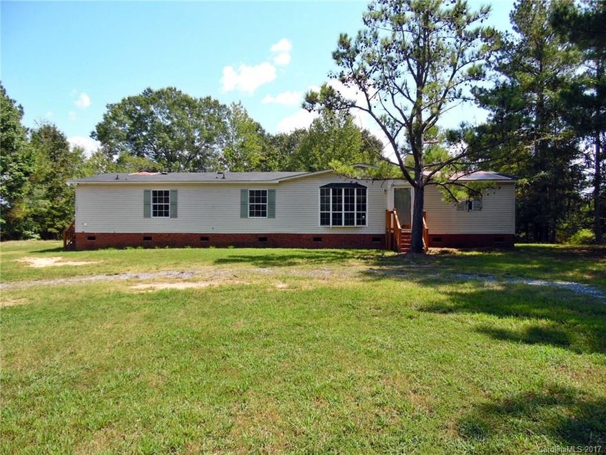 Tucked off the road among the trees in a rural country setting, this spacious 3 bedroom, 2.5 bath mobile home offers large master with sitting area, cozy den with wood burning fireplace, vaulted family room, formal dining room, and open kitchen with lots of cabinetry. Enjoy a desirable floor plan with lots of square footage! Strongly encouraged that offers include proof of funds/pre-approval & is required for seller's final acceptance.