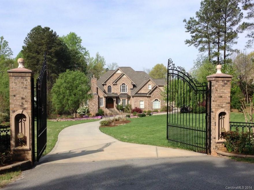 Grand secluded retreat on 1.47 acre waterfront w/lrg sandy beach, resort bkyd w/saltwater pool, tranquil tone waterfall, spa, outdoor frpl & outdoor KT. Add'l 1300+ sf(not incl. in sf) in beautiful carriage house w/lrg rec room, 2 full BTs, possible BR. Exquisite attention to detail-luxury BTs, Brazilian cherry flring, mahogany doors, Chef's KT, add'l KTette on lower level. Inviting lrg scrn'd por