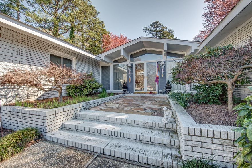 Mid-century Modern! Custom Home! Great yard!This fantastic mid-century modern home loaded with custom features!  Upon arrival guests will approach dbl driveways connected w circular driveway, beautiful mature trees,flowering landscape! Step inside to stunning great room w loads windows,custom wood ceiling beams magnificent brushed brass fireplace awning! Next enter cozy den/keeping room- walls of windows overlooking back side yards-easily connects dining/breakfast room/kitchen.Kitchen has new air fryer range,skylight overlooks front courtyard. Next,the pantry, utility room-storage galore w/ 1/2 bath.  A few steps down leads to the Game room with built ins, walk in storage, built ins and wood accents.  Don't miss the craft/storage room connected to this space!  The other side of the home has the primary bedroom ensuite with double closets.  The other 2 bdrms share hallway bath,also have nice storage -natural light.  The yard is 1/2 acre and home has been well maintained!  Move in ready!