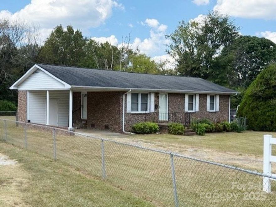 Great brick home offering 3 bedrooms, 1 full bathroom, a living room and combined kitchen and dining area that provides a functional layout for everyday living. This property also includes a convenient single-car carport. Step outside to enjoy a large fenced backyard, ideal for pets, play, or entertaining. While the home could use a little TLC or updating, it has great potential to be transformed into a wonderful place to call your own.