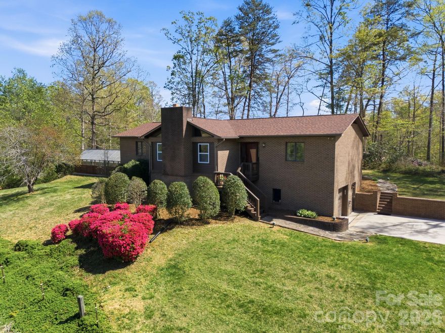 Set on nearly 50 pristine acres in the foothills of Western North Carolina, this fully re-imagined estate offers a rare blend of refined living and premier equestrian amenities. Thoughtfully renovated, the property delivers a turnkey lifestyle with privacy, beauty, and modern upgrades. The stately brick home has been extensively updated, including a new roof (2025), windows, flooring, paint, siding, and a striking front entry. Inside, a redesigned kitchen features granite countertops, new appliances, and custom finishes. Spa-inspired bathrooms including a luxury bath with bidet- elevate the home’s comfort. Hardwood floors span the upper level, while luxury LVP enhances the lower level. The lower level provides flexible living space with a media room, full bath, and an additional finished room with closet. Major system improvements include updated electrical and plumbing, a whole-house Aquasana filtration system, and a serviced gas-log fireplace. Outdoor living is highlighted by a newly constructed back deck overlooking manicured grounds and serene natural surroundings. A greenhouse retreat with a Michael Phelps swim spa creates a private wellness escape. Equestrian facilities are equally impressive. The 9 stall barn includes large stalls with automatic watering capability, a remodeled apartment, climate-controlled and updated tack room, wash bay, and hay storage. The property features 12 open acres with two fenced paddocks for rotational grazing, open pastureland, and space for a future riding arena. Enjoy scenic trails throughout the property, along with two creeks, and a natural spring. Two serviced wells, one for the home and one for the barn, both feature new pressure tanks. Additional highlights include RV hookups, a concrete driveway, garage with workshop, and storage building. Conveniently located just 3.5 miles from Lake James State Park, near I-40, and within easy reach of Asheville and Tryon International Equestrian Center. A rare opportunity to own a turnkey luxury equestrian estate where sophistication meets serenity.