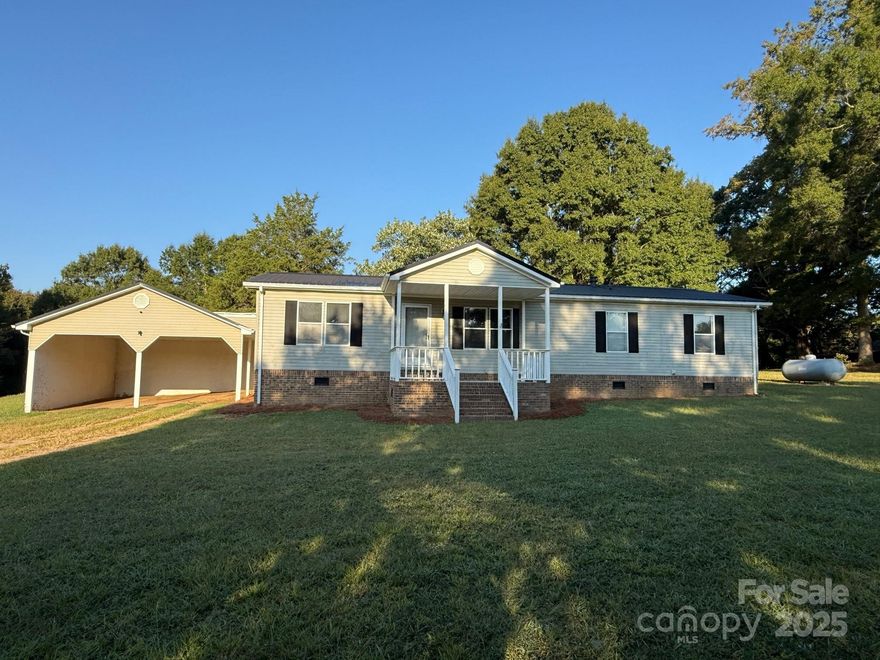 Enjoy country living with modern comforts in this beautifully updated home on 2.7 acres. Step outside to your private backyard retreat featuring a large covered back deck and an in-ground pool with water feature, diving board, 25-year liner (installed 2021), and spacious concrete surround. Inside, the home was remodeled in 2017 with fresh flooring, paint, and a stunning walk-in tile shower in the primary bath. The primary suite also offers a walk-in closet for plenty of storage. Major updates include a new roof and HVAC system in 2019 and all-new plumbing. A storage building adds extra convenience. With 8 feet of depth at the pool’s deep end, this property is perfect for both relaxation and entertaining