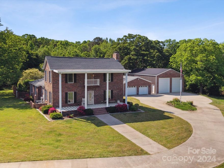 Exclusive and rare opportunity to own this incredible property nestled on over 2 acres, this colonial gem was originally built in 1860 and renovated in 2012.  As you enter the property through your private remote controlled gate you will notice the large pecan trees surrounding the home as you make your way to the home on the large concrete driveway you will notice every mans dream workshop garage as you round the circular drive that is large enough for your classic car collection, boat, RV, atv's and more. The property not only has a large commercial garage but also has a 2 car detached garage for your every day drivers.  Once inside you will notice an exquisite kitchen with custom cabinets, granite counters, hardwoods throughout and a sought after open floorplan.  The primary bedroom is on the main floor and each bedroom has its own private bathroom. Enjoy morning coffee on your rear private screened porch or on your covered front porch. Don't miss this one of kind family homestead.