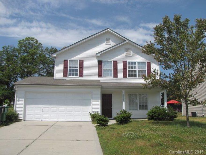 Move-in ready with fresh paint and new carpet! This home with an inviting front porch in the Coulwood area offers easy access to I-485, I-85, Mt Holly, the U.S. National Whitewater Center, schools, and more! The floor plan includes a living room-dining room with a fireplace, a loft, and a first-floor master suite. The community playground is a short stroll away!