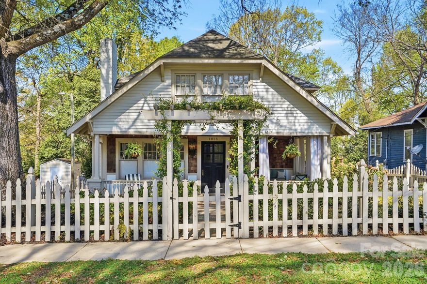 Welcome to 1815 Seigle Ave—where timeless Craftsman charm meets modern comfort in the heart of Villa Heights! Built in 1910, the home is believed to have once been owned by the Pfifer family, the neighborhood's founders.  This rare two-story bungalow offers 5 bedrooms and 3 full baths, seamlessly blending historic character with tasteful updates. Step through the classic picket fence into a home rich in detail, featuring original millwork, custom built ins, abundant natural light, and beautifully restored hardwood floors. The spacious open kitchen with granite countertops & gas range with matted gold pot filler is a chef's delight. The flexible floor plan includes a private main-level bedroom suite—ideal for guests or multi-generational living.

Extensively renovated in 2015, this well-maintained home also features a newer roof (2015/2018), a detached two-car garage, and a bonus office or studio space—perfect for working from home or a creative retreat. The fenced in backyard oasis, complete with an outdoor fireplace (added in 2022), is ideal for entertaining and offers an impressive view of the Charlotte skyline from the deck. 

Located just steps from Cordelia Park, minutes from the Parkwood Light Rail Station & Little Sugar Creek Greenway. With easy access to the eclectic dining and shopping of Plaza Midwood and NoDa, this stunning home offers the best of city living in a thriving, vibrant community!