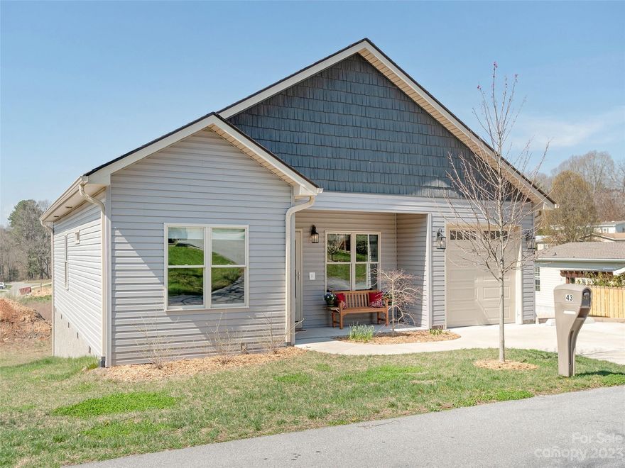 This well maintained recently built home features 3BR, 2BA main level living in a country setting and yet minutes from shopping. Spacious vaulted ceiling in the living room and 9-foot ceilings throughout the rest of the house. Or step out into the countryside on your large covered back porch to entertain, relax, listen to nature and feel the warmth as the sun sets. Efficient heat pump supplies heating and cooling comfort year around. And feel secure knowing the whole house stand by generator will provide effortless power in an emergency. Some of the many upgrades include the living room built-ins with a modern look electric fireplace, heated garage plus off street parking for 2 vehicles, a whole house surge protector and many more desirable touches. This home is located in the quiet friendly 55+ community of White Oak Village, which you'll be pleased to know has an exceedingly low HOA. Please come for a tour and visualize yourself in your new home.