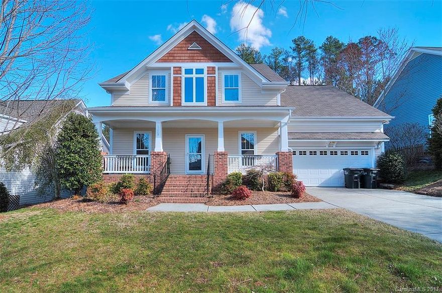 Craftsman style home with open floor plan. Hardwood floors throughout main living area. Formal LR & DR. Kitchen w corian counters, black appliances. Breakfast bar. Great room w vaulted ceiling & gas logs in fireplace. Laundry room on main. Master suite on main w tray ceiling & fan. Master bath w dual sink vanity, separate tiled shower/tub. Three spacious secondary bedrooms & bonus room share a bath on upper level. Private backyard w patio, deck & invisible fencing. Irrigation. Fort Mill schools