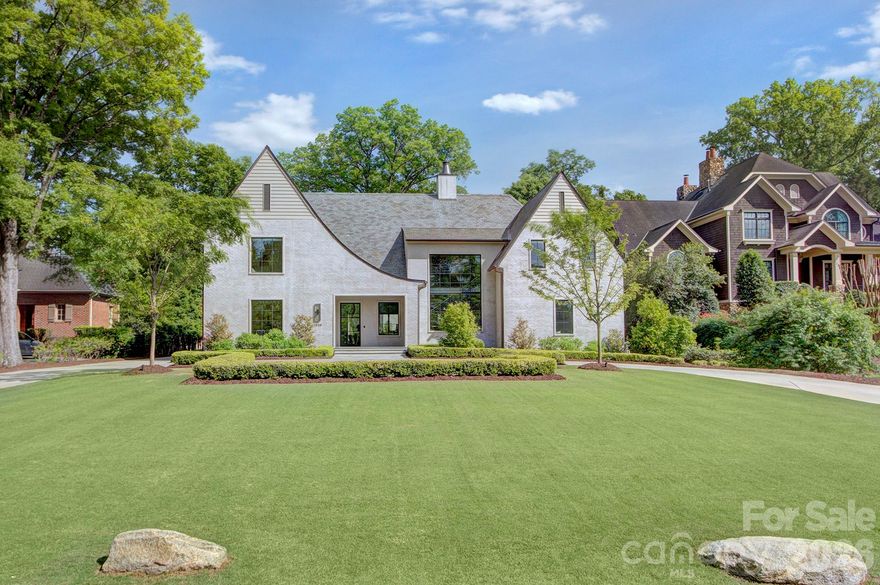Absolutely stunning home located in one of Myers Park's best pocket neighborhoods.  This custom contemporary home features a circular driveway, covered front entry, slate roof, slurry brick finish, copper flashing and custom steel and white oak staircase. Open concept living with abundant natural light.  Formal dining room, bar with beverage refrigerator, chef's kitchen with quartzite island, 48" Wolf duel fuel range, plastered hood, 36" Sub Zero refrigerator, wine fridge. Breakfast area and huge pantry. Covered cabana features automated shades and wood burning fireplace with gas starter, infrared heaters and 36" Lynx built in grill. Large living area with automated slider doors that open to a private fenced backyard with turf and saltwater heated pool with spa and tanning ledge and private pool bath.  Detached garage offers 4 car tandem parking and living space above, with full refrigerator and cabinetry, workout area and full bathroom. Outdoor shower. Primary retreat on the main level with automated shades, huge closet with laundry connections.  Upper level features gallery wall and four ensuite bedrooms and oversized laundry room.  Third level bonus with half bath and great storage area. Control 4 lighting. Electric gate, generator. This is a truly special home in the heart of Charlotte, convenient to shopping, restaurants and schools.