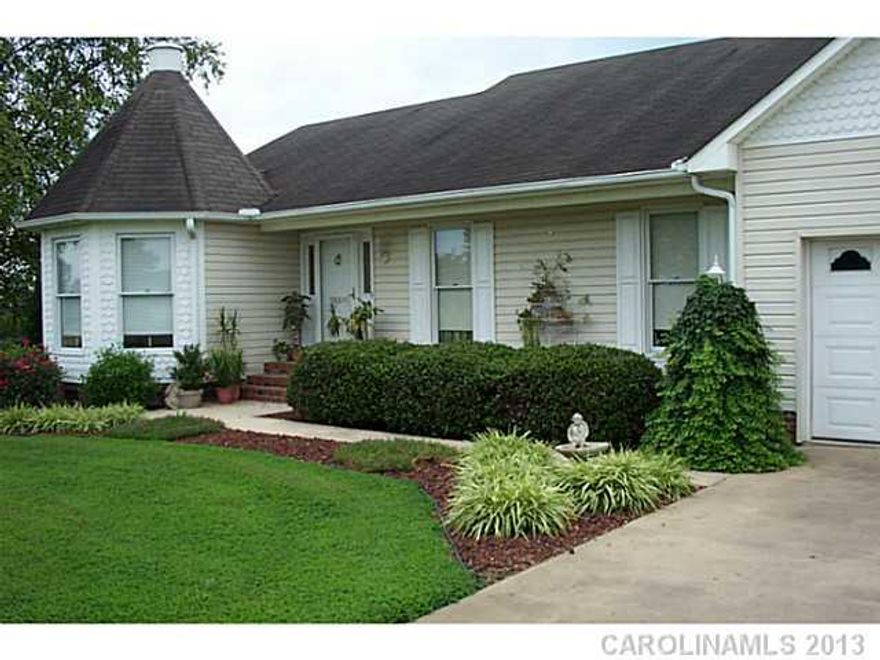 This home is beautiful and the back yard a dream.  It has two level decking with a hot tub, special lighting, a hidden garden, a gas grill,  and a over sized workshop. The living room has a rock fireplace and walks out to a sunroom.  The kitchen offers a great breakfast bar, all new appliances that are stainless and plenty of cabinets for storage.  Beautiful.....