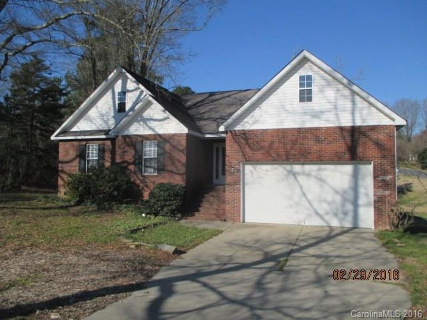 Partial brick home on half an acre corner lot. Home features 3 bedrooms, 2 bathrooms, kitchen, and living room. Features include some wood floors, master suite with tray ceilings and double sink bath, kitchen with ample cabinet spaces and vaulted ceiling, deck, and 2 car attached garage.