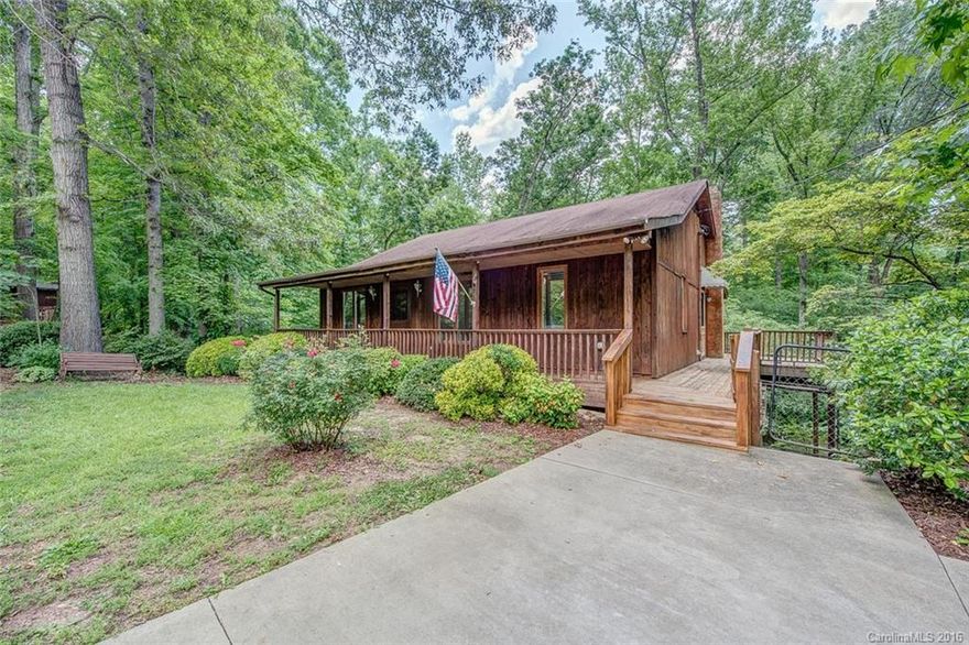 Mountainous feel! Gorgeous wood floors! Basement heated & cooled! Plenty of decks for outdoor entertaining & front porch sitting. Huge attic w/lots of floored storage. This home has second kitchen & living area in the basement including a full bath & 3 separate rooms & dining area.The vintage stove in the basement does work & is to convey w/the home (per seller).This is all situated in the Clover School District & an easy commute to Charlotte,Rock Hill,Gastonia.Property to be "sold as is".