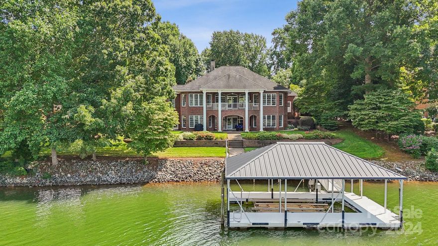 Welcome home! Check out this beautiful, all brick waterfront home on Lake Norman with amazing views!  Single owner, meticulously maintained -great landscaping, hassle free private dock with lift.  Ideal for entertaining - full kitchen with all appliances on the lower level, walk out lake access .  Open flow on main level with primary, kitchen, dining and living areas plus a flex room currently used as an office.  3 car side entry garage.  Fireplaces on both levels, tons of storage available including exterior accessible area ideal for storing lake toys!  HVAC units less than 2 years old, irrigation system, dual fuel heating with propane for colder days, generator, irrigation, water filtration and softener systems with UV light - the list goes on and on!  Fantastic location close to Langtree, Mooresville and Davidson with a private community feel!  No septic permit on file, listed as a 4 bedroom based on tax records - current owners using first floor room as office, could be bedroom.